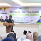 Bupati Aceh Besar Muharram Idris menyampaikan sambutan dalam talk show ICMI dan MES Aceh Besar tentang penguatan ekonomi syariah di Hotel Madinatul Zahra, Darul Imarah, Aceh Besar, Sabtu (7/3/2026). Foto: Dok. MC Aceh Besar