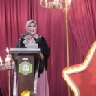 Wali Kota Banda Aceh Illiza Sa’aduddin Djamal memberikan sambutan pada pengukuhan 232 lulusan SMK SMTI Banda Aceh Angkatan ke-57, Kamis (16/7/2026). Foto: Dok. Prokopim Kota Banda Aceh